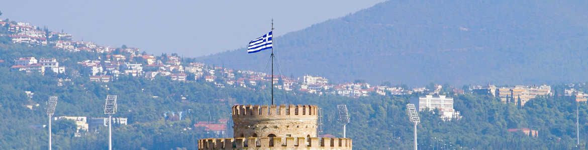 White Tower of Thessaloniki with Greek flag